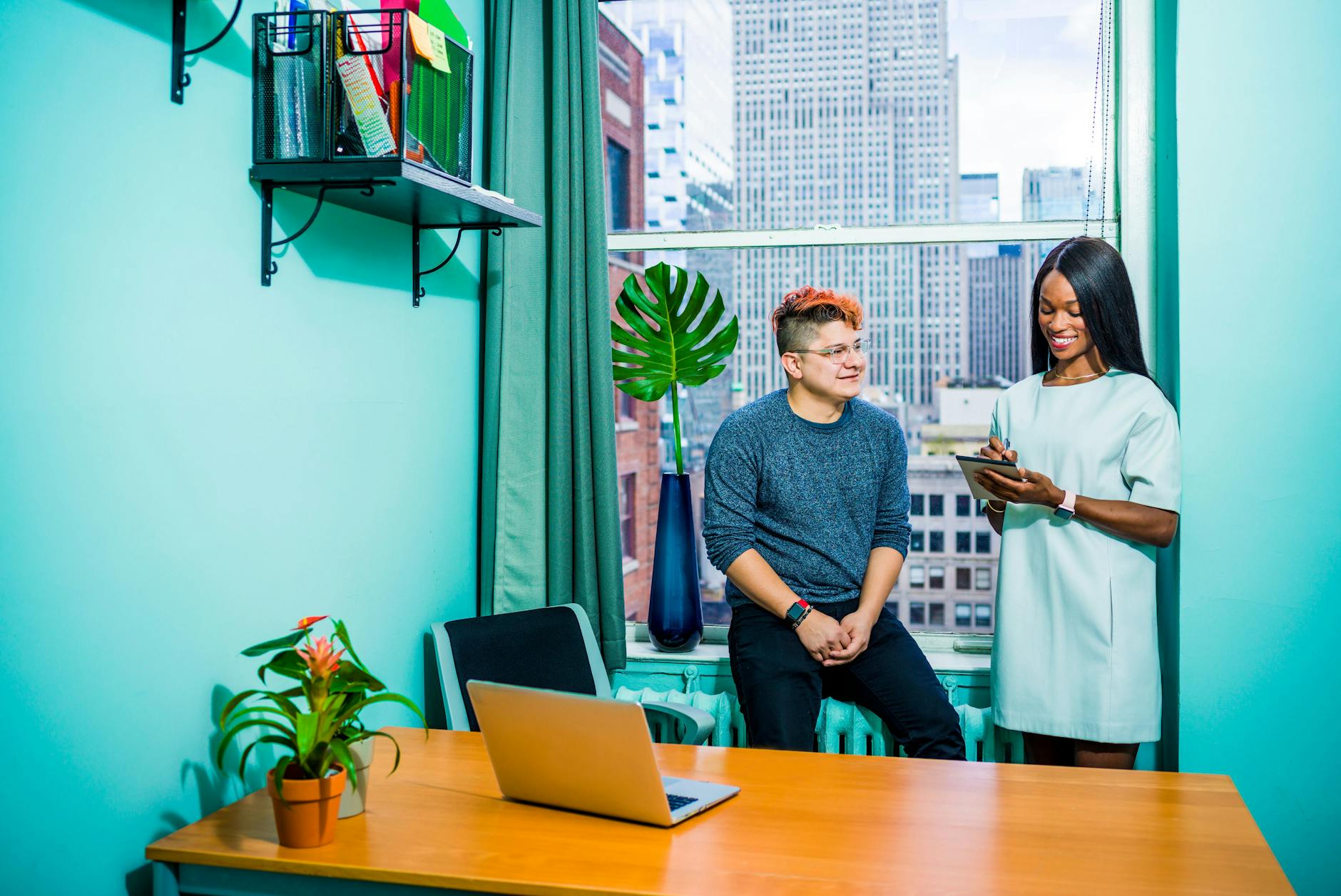 woman standing beside window