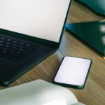 modern office workspace with laptop and smartphone