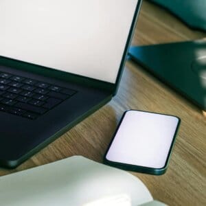 modern office workspace with laptop and smartphone