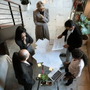 people sitting on chair in front of table