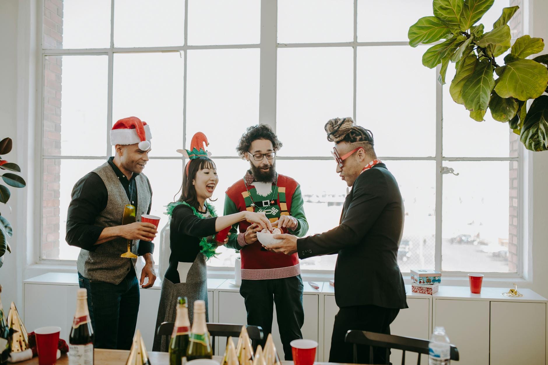 Four people laughing together, representing how businesses try to attract everyone instead of the right audience, which is one of What Are the Top SEO Mistakes Small Businesses Make.