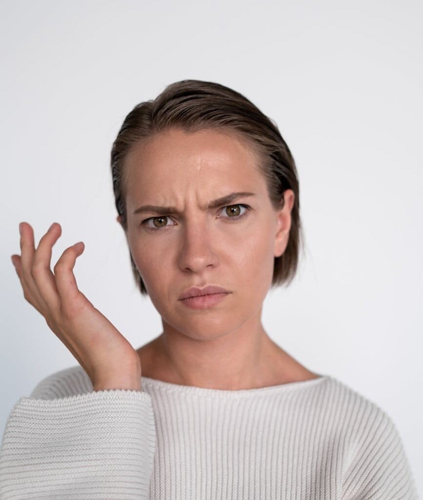 a portrait of a woman with a confused facial expression
