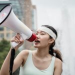 female protester using a megaphone
